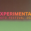 red and green colours merged together and text experimental photo festival 2024 over the top